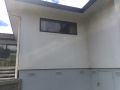 Reclad before shots   side of house